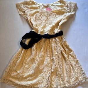 Elegant Cream Lace Dress with Black Bow